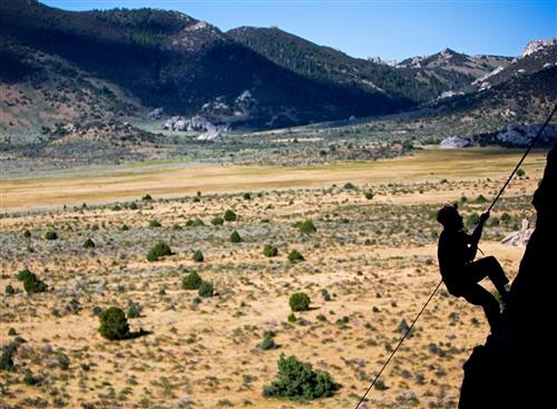 Retired Army Specialist Jerad McCann repels down the Hostess Gully at Castle Rock State Park in Almo, Idaho during an event f 